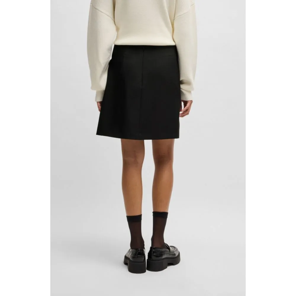 Wrap mini skirt with branded belt buckle